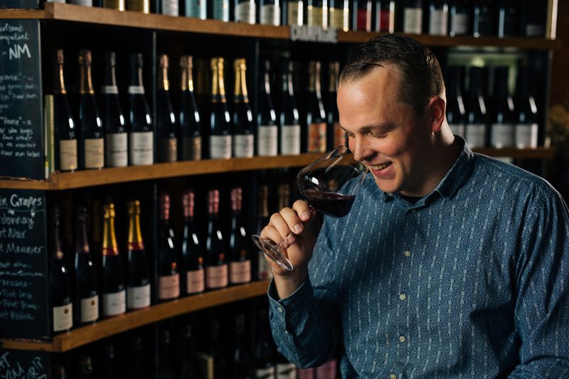 Peter Wassam enjoying some wine.