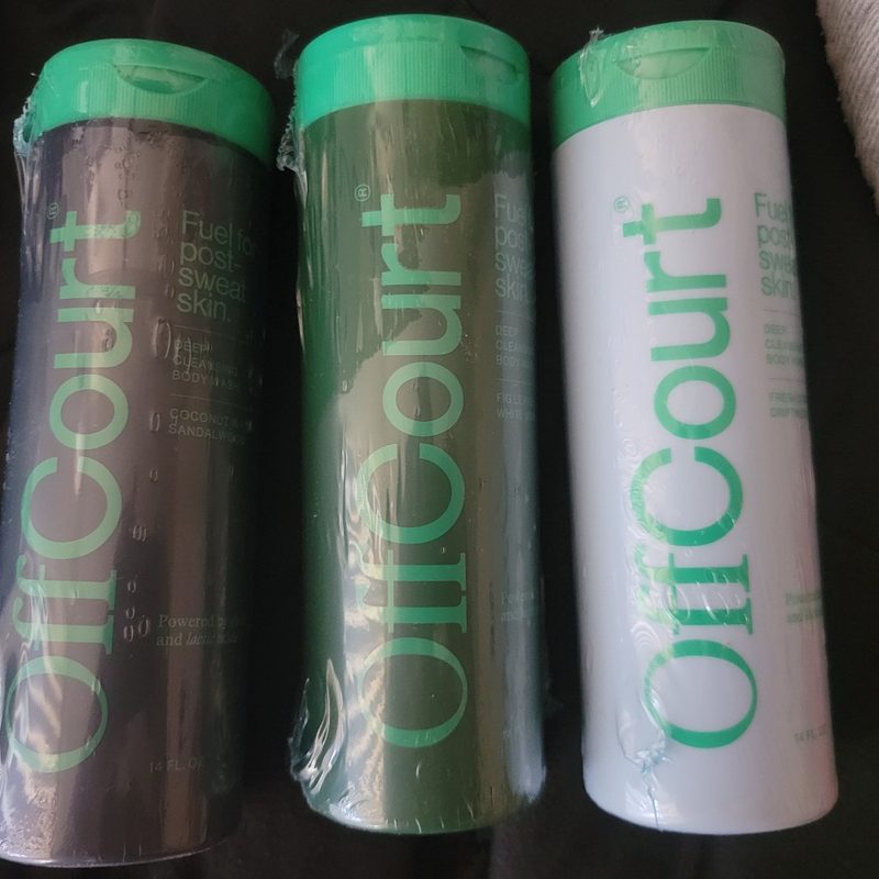 A group of bottles of OffCourt Deep Cleansing Body Wash.