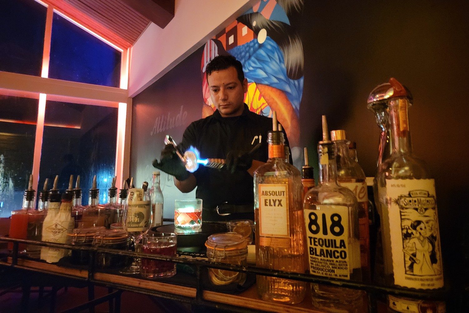 The mixologist prepares cocktails at LG Smith’s Steak & Chop House at Renaissance Wind Creek Aruba.
