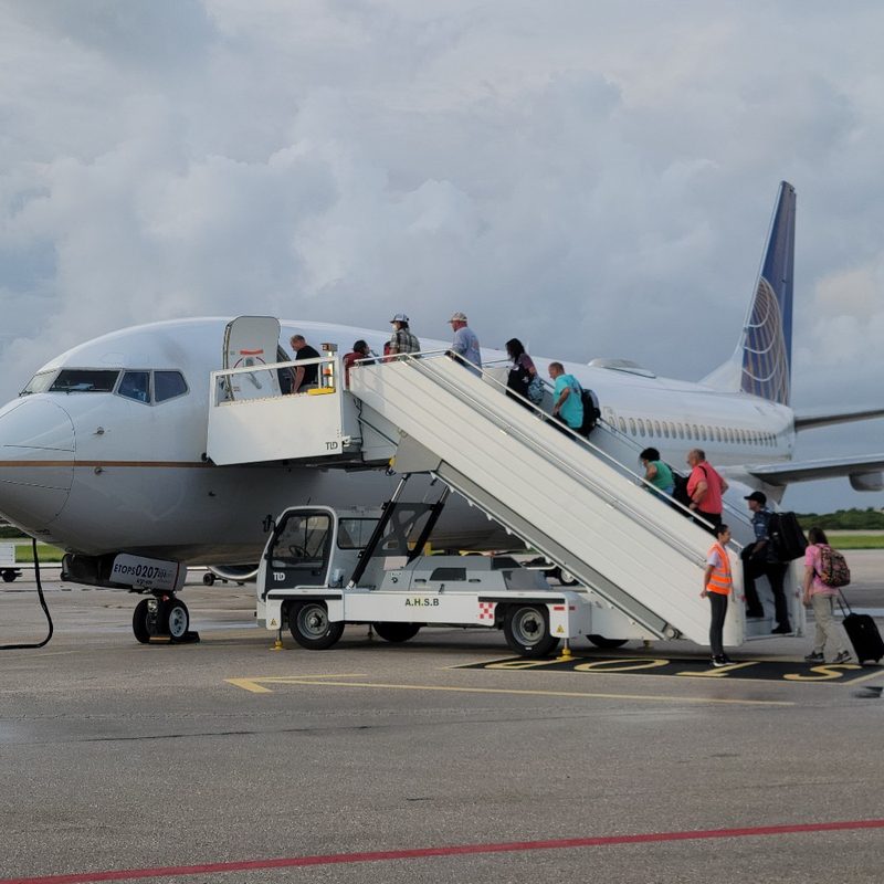 A United Airlines airplane boards at Flamingo - Bonaire International Airport.