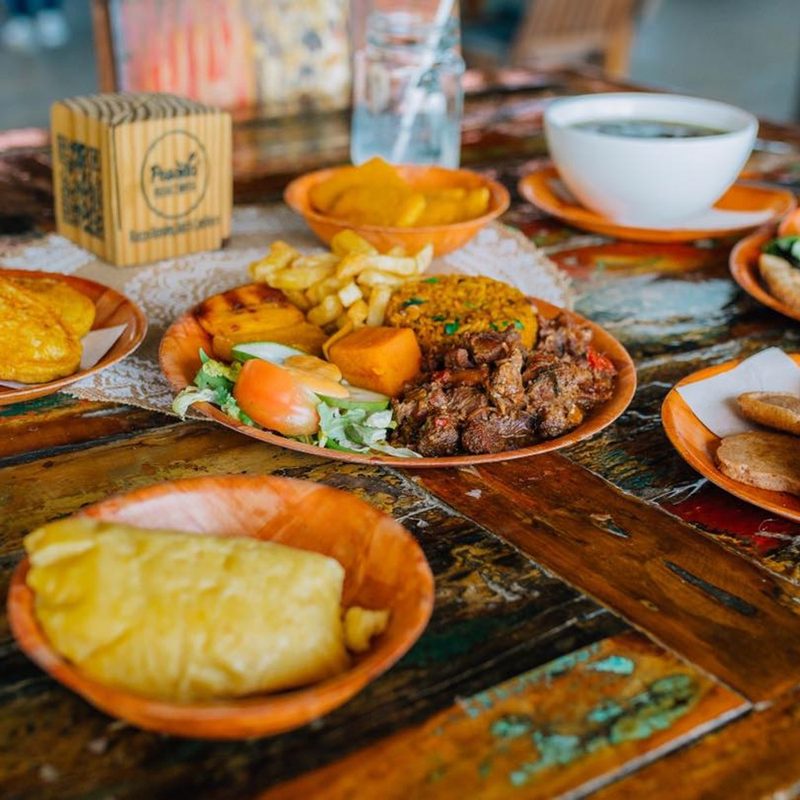 A table with many plates of food at Posada Para Mira Bonaire.