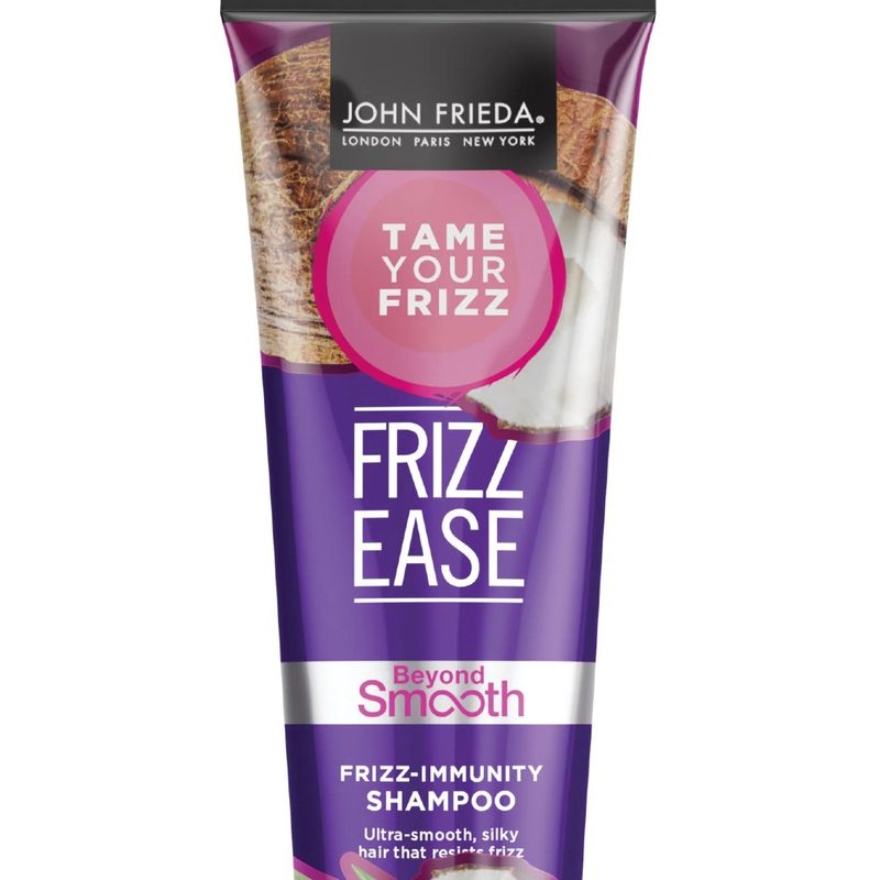 A close-up of a bottle of John Frieda Frizz Ease Beyond Smooth Shampoo.