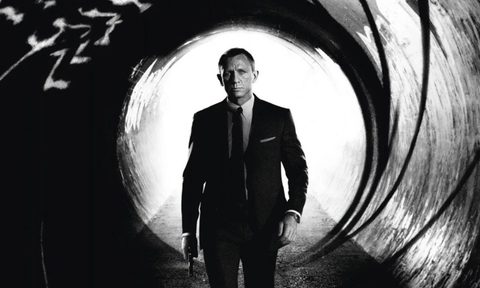 James Bond walking toward barrel