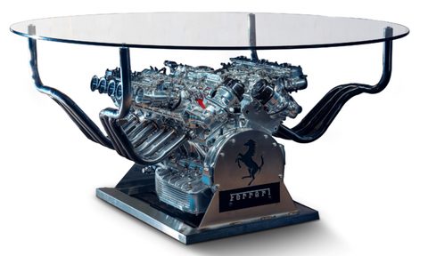 Ferrari V12 engine being auctioned off at RM Sotheby's from a Ferrari 365 GTC/4 in front of a white screen.