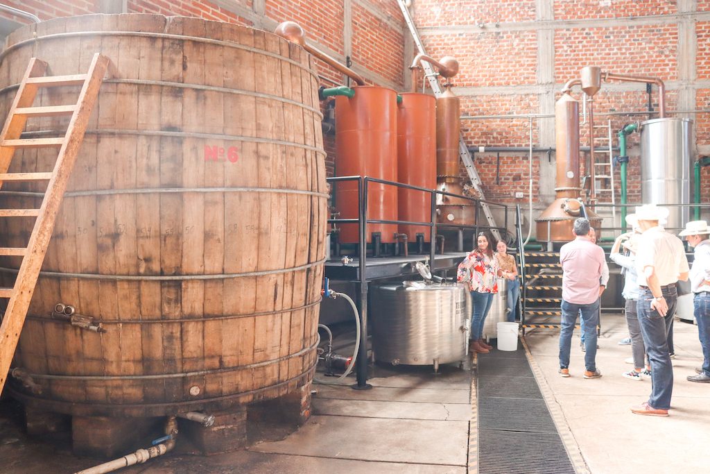 Visitors check out the distillery