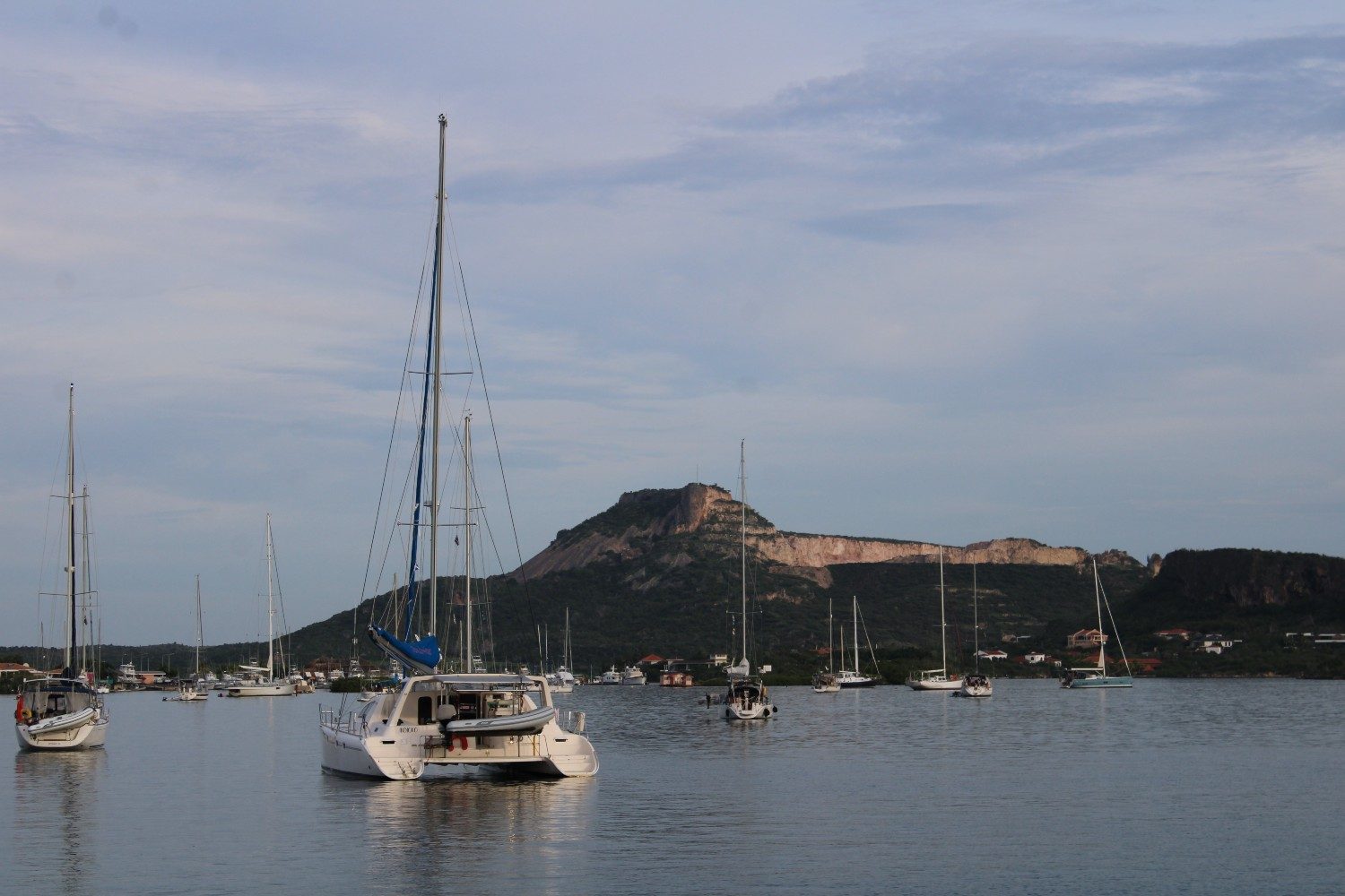 A view of the rugged landscape of Curaçao from an Irie Tours Sunset Sail boat.