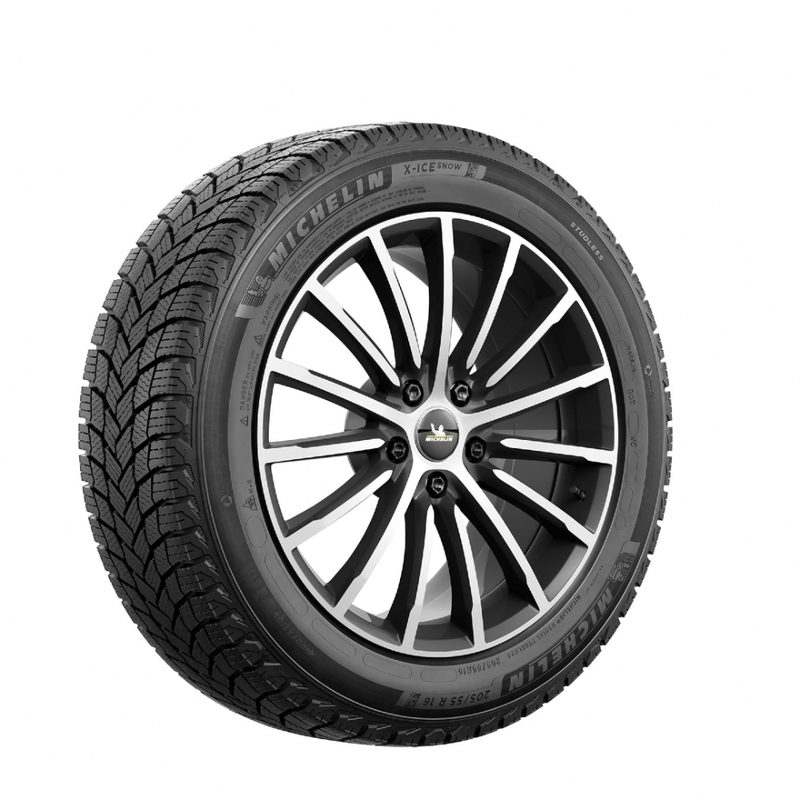 Close-up of Michelin winter tire in front of a white screen.