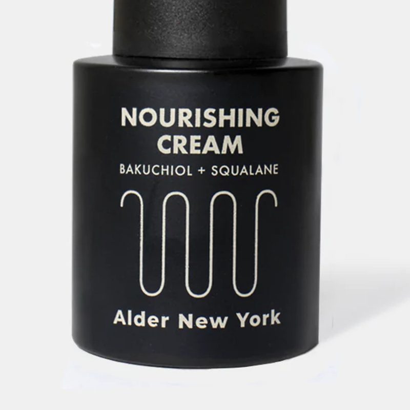 A close-up of a bottle of Alder New York Nourishing Cream.
