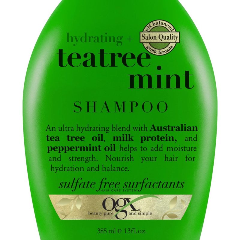A close-up of a bottle of OGX Hydrating + Tea Tree Mint Nourishing & Invigorating Daily Shampoo.