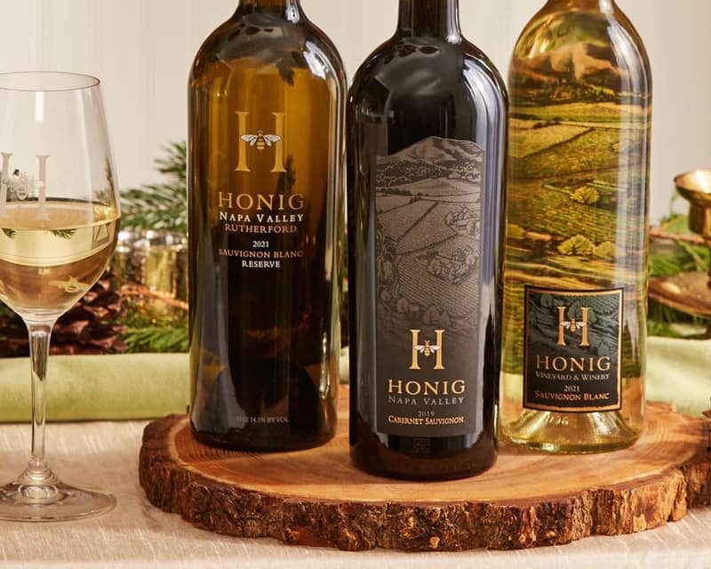 A set of three Honig wine bottles.