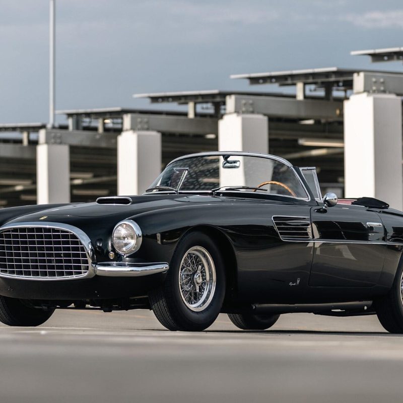 1954 Ferrari 375 America Vignale Cabriolet front end angle from driver's side in a parking lot with top down.
