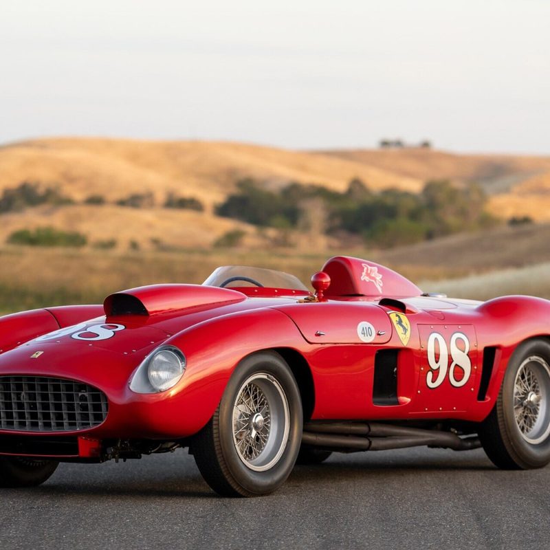 1955 Ferrari 410 Sport Spider front end angle from driver's side parked in front of rolling brown hills.