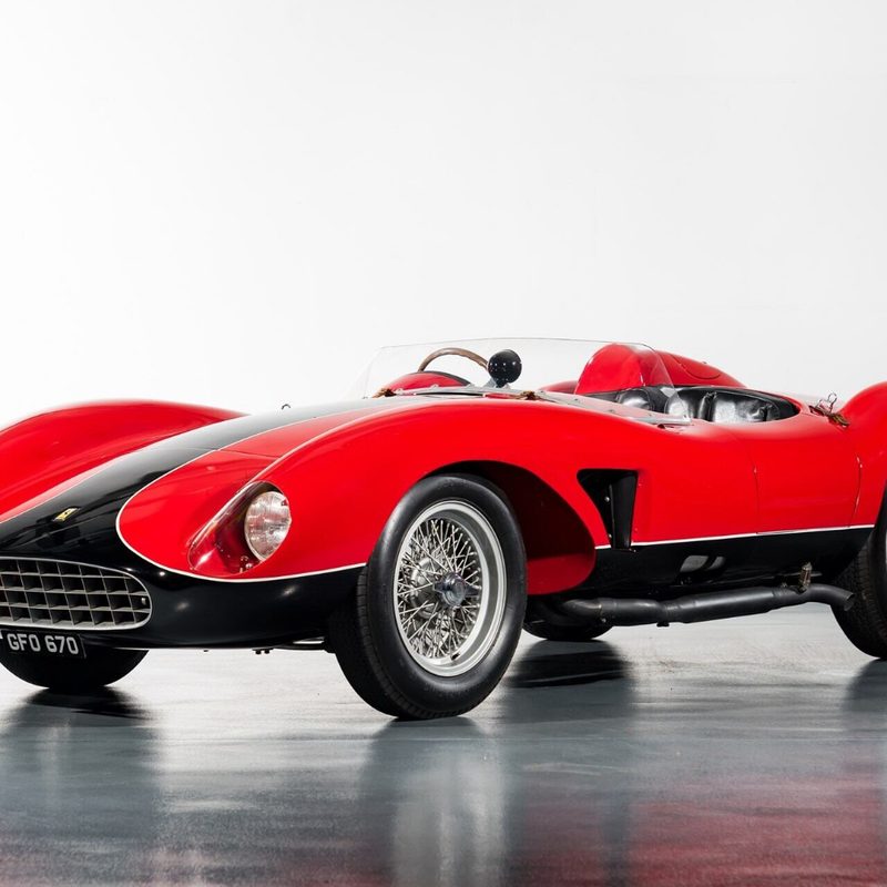 1957 Ferrari 500 TRC Spider front end angle from driver's side in a studio with a white wall.