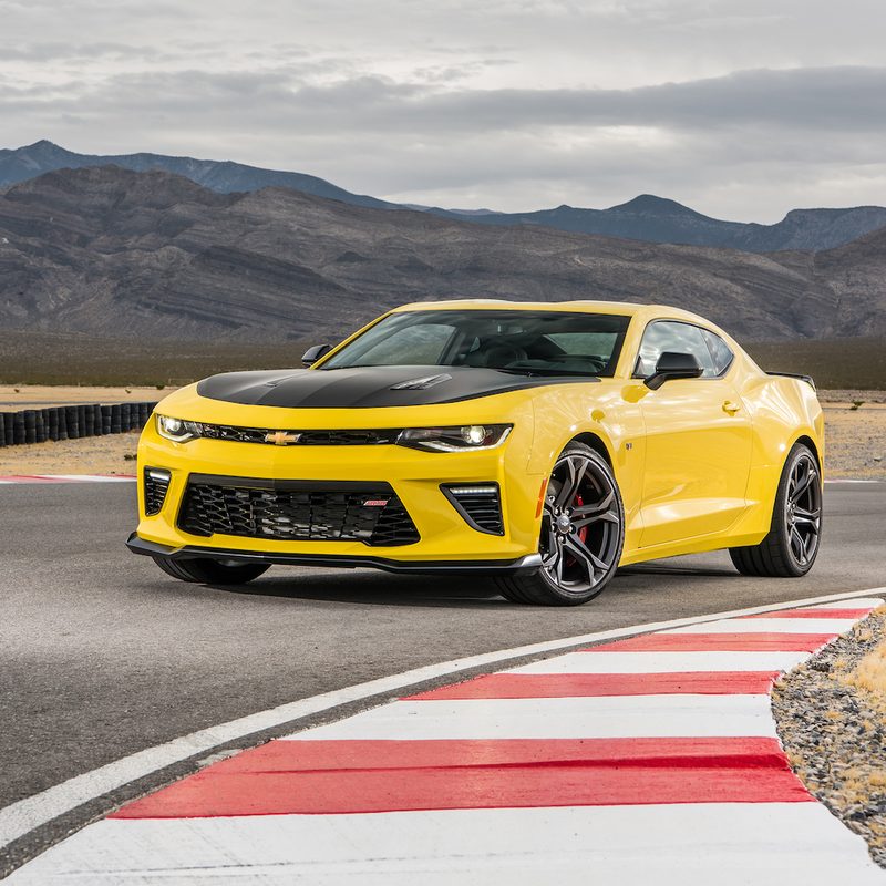 2017 Chevrolet Camaro SS 1LE front end angle from driver's side parked on a race track with mountains in the back.
