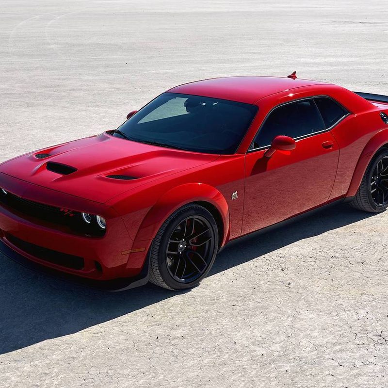 2022 Dodge Challenger R:T Scat Pack Wide Body front end angle overhead shot of the car parked on a salt flat.