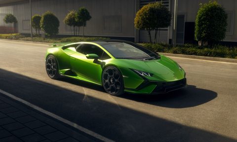 2023 Lamborghini Huracan Tecnica front end angle from passenger's side parked on the road with buildings in the back.