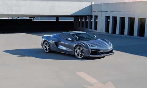 2024 Chevrolet Corvette E-Ray front end angle from passenger's side in a parking garage.