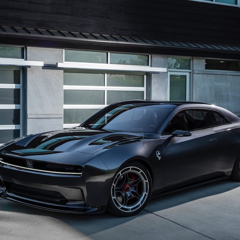 Dodge Charger Daytona SRT Concept front end angle from driver's side parked in front of a garage.
