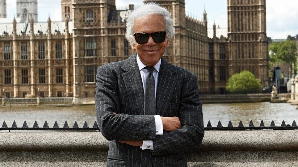 Ralph Lauren standing in front of a palace in a suit