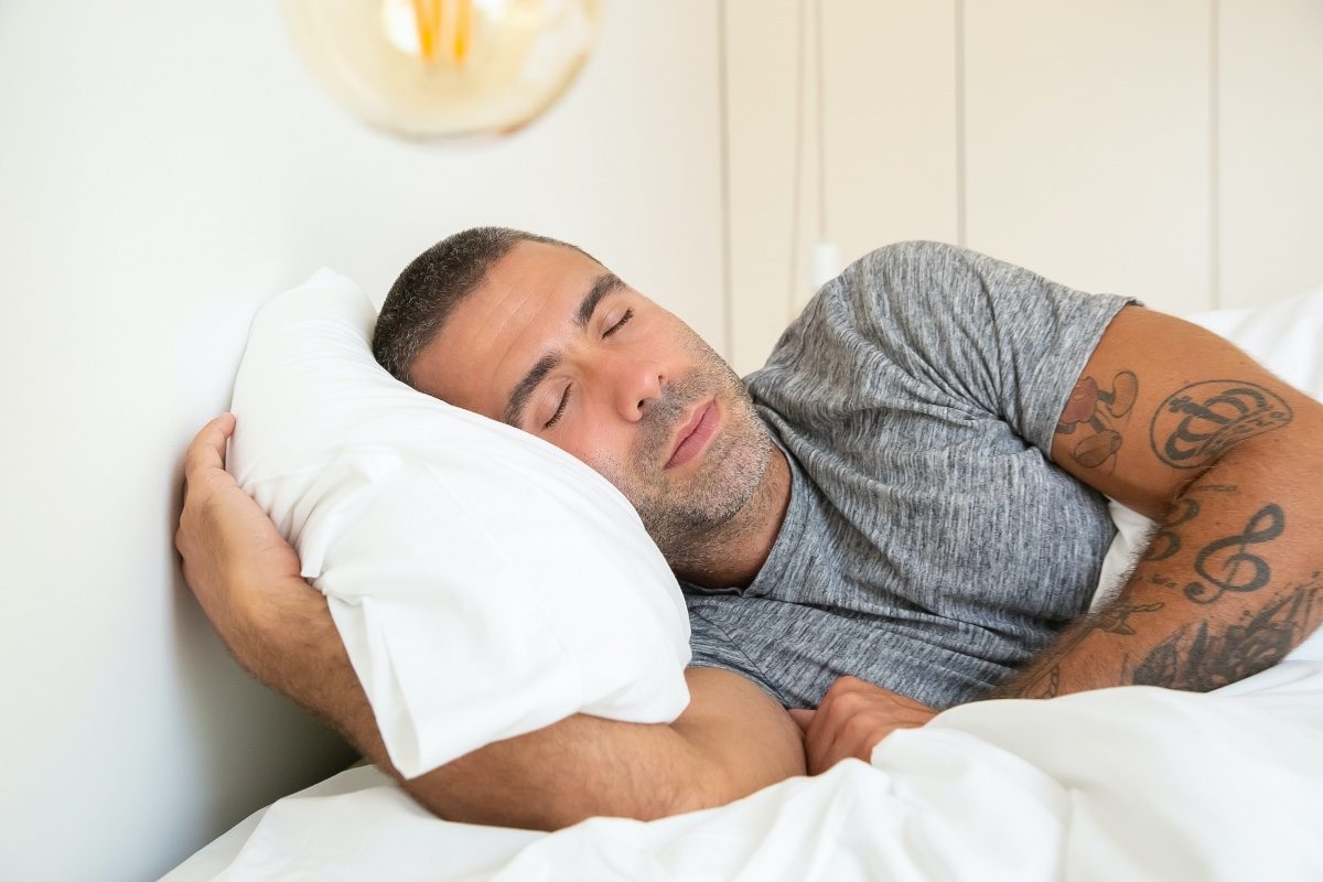 a man sleeping on a bed
