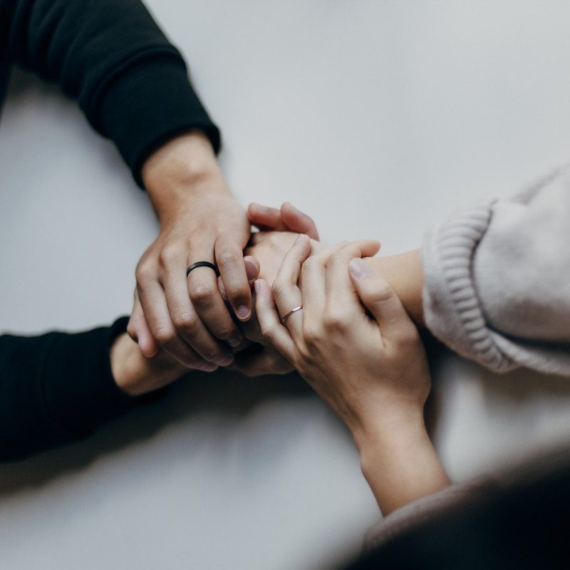 A man and woman holding hands.