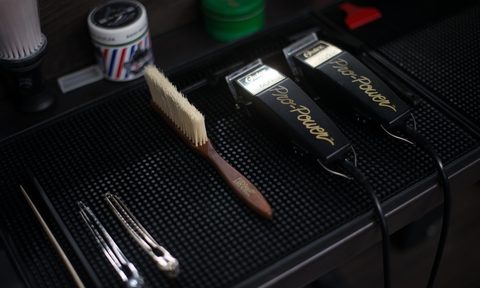 men's grooming tools on black background