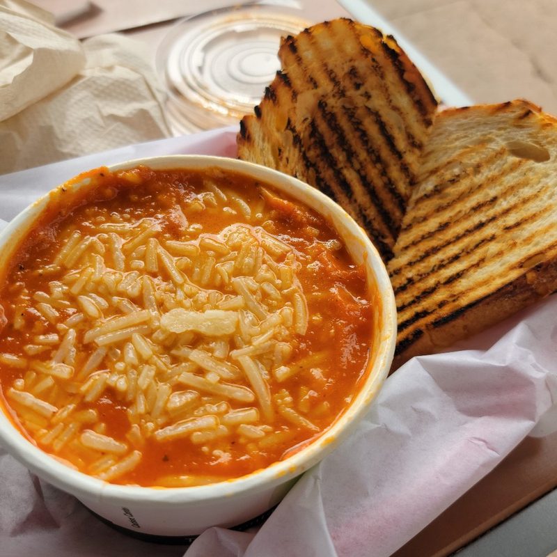 A cup of tomato bisque and a grilled cheese sandwich at Coffee Importers in Dana Point, California.