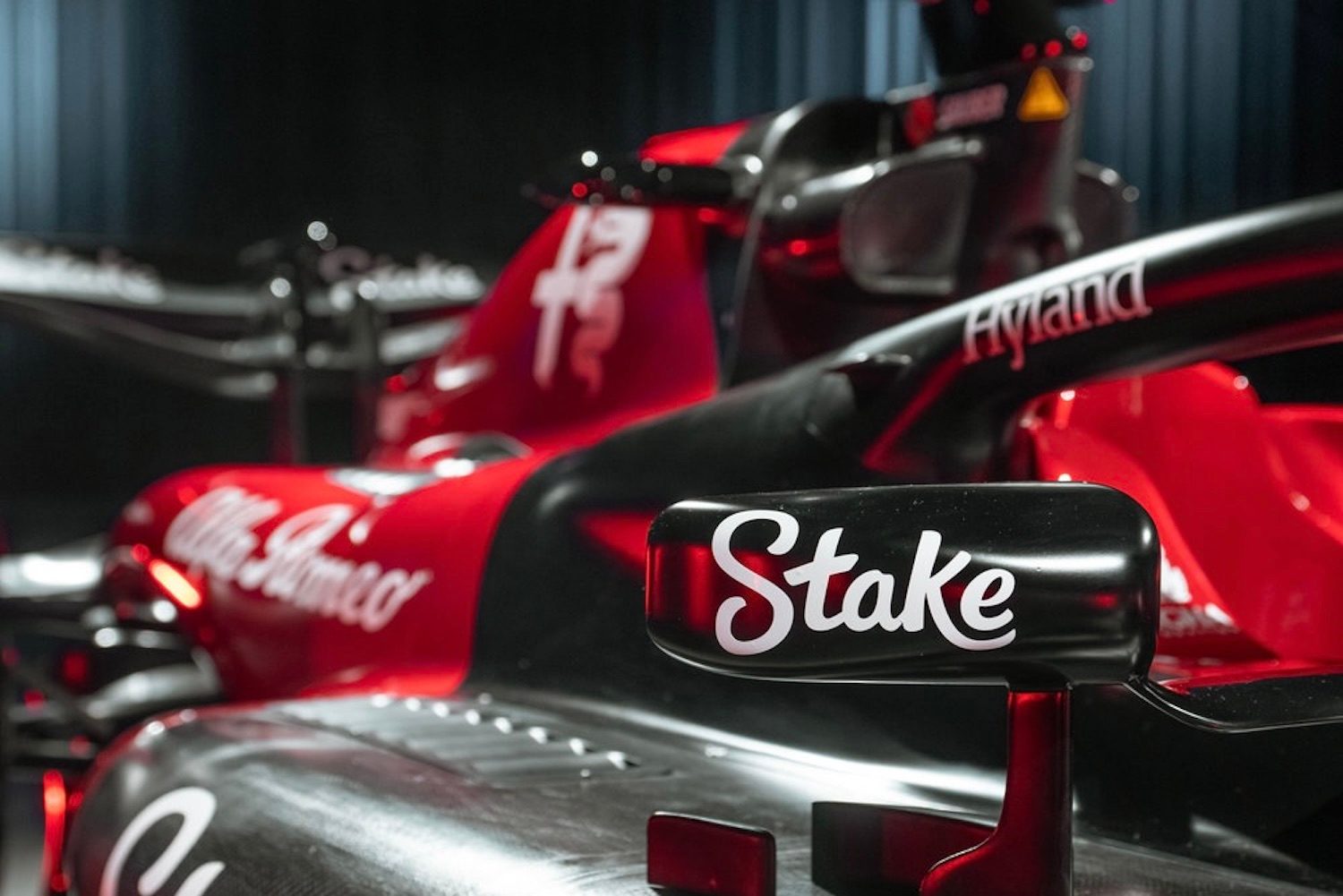 2023 Alfa Romeo F1 C43 close up of side of the show car and front mirror.