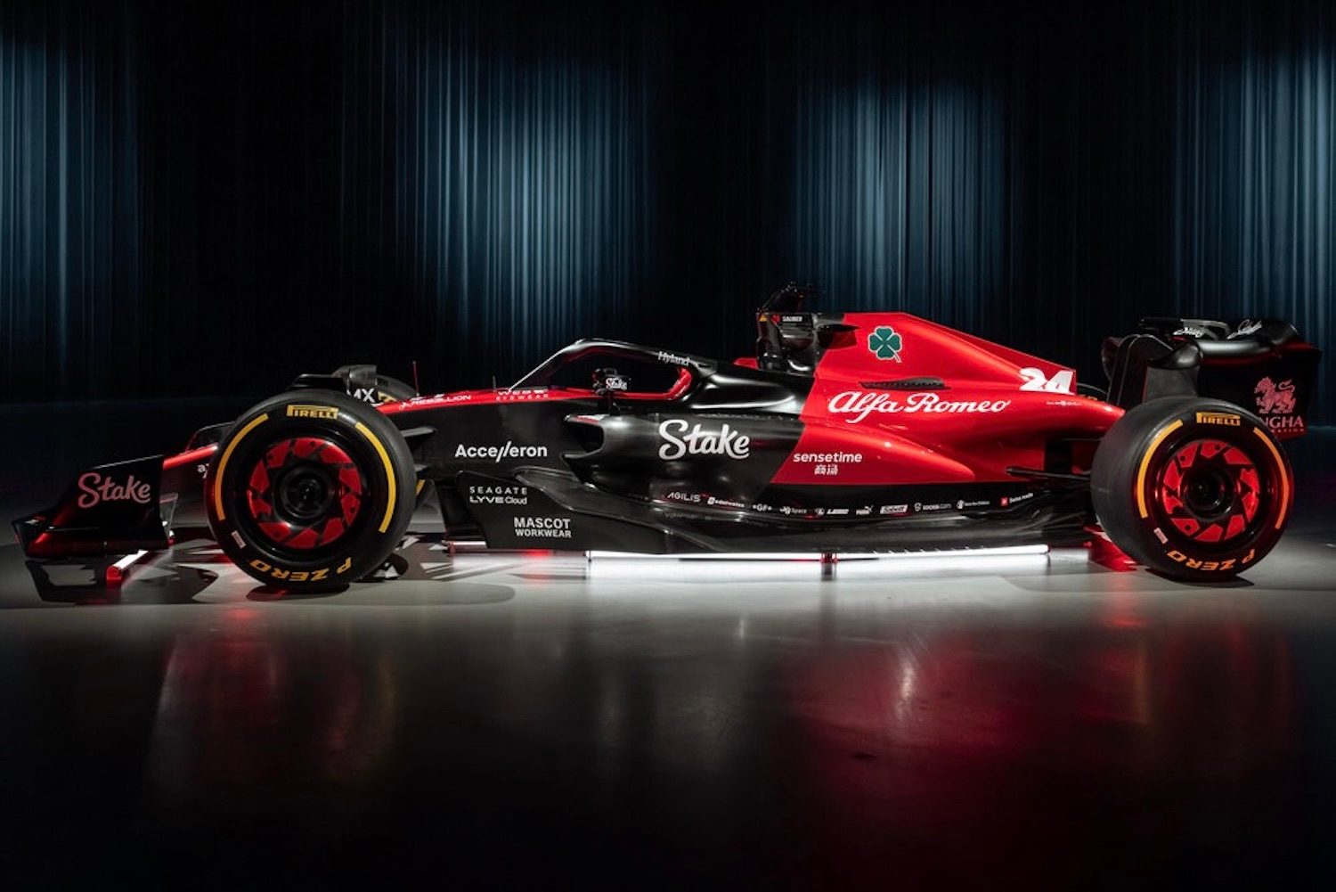 Side profile of the 2023 Alfa Romeo F1 C43 show car in a studio with studio lighting.