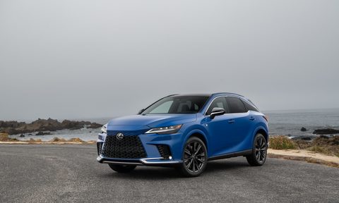 2023 Lexus RX 500h F Sport front end angle from driver's side parked on the side of the road in front of a cliff.