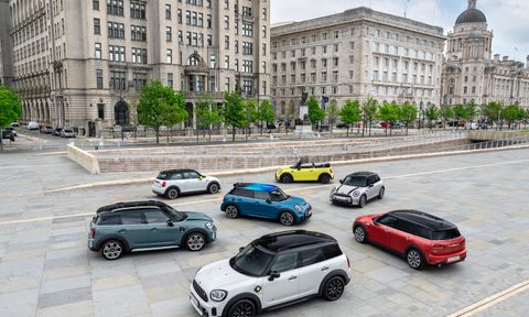 2024 Mini Cooper Family parked in front of old British buildings on a paved road.