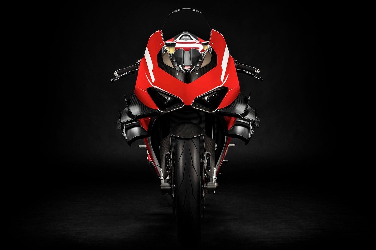 Ducati Superleggera V4 close up of front end of super bike with a black screen.
