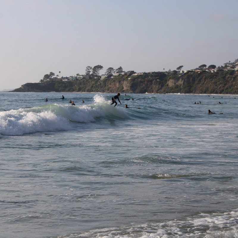 A surfer rides a wave at Salt Creek Beach in Dana Point, California.