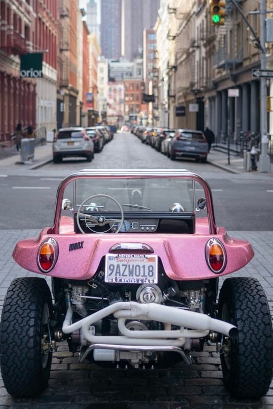 Meyers Manx Remastered Kit rear end close up parked in an alley behind parked cars.