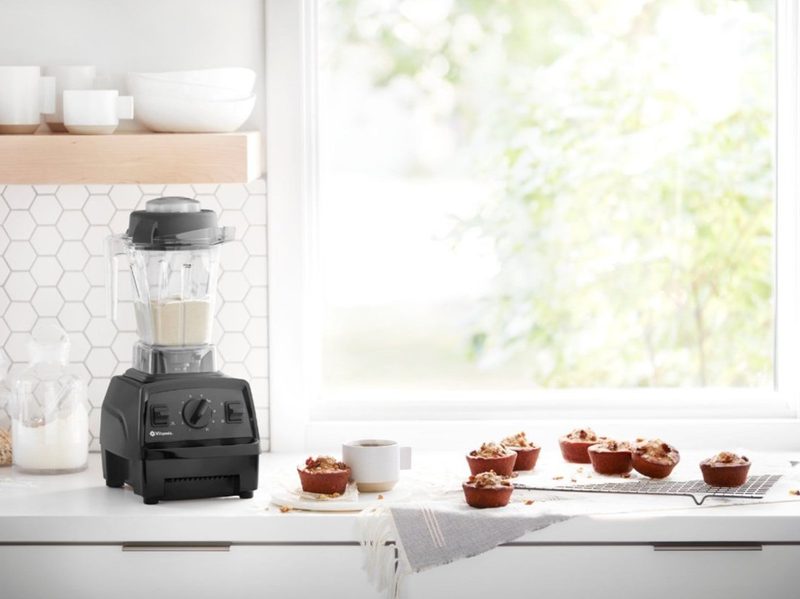 Vitamix Explorian Series E310 blender with food on counter.