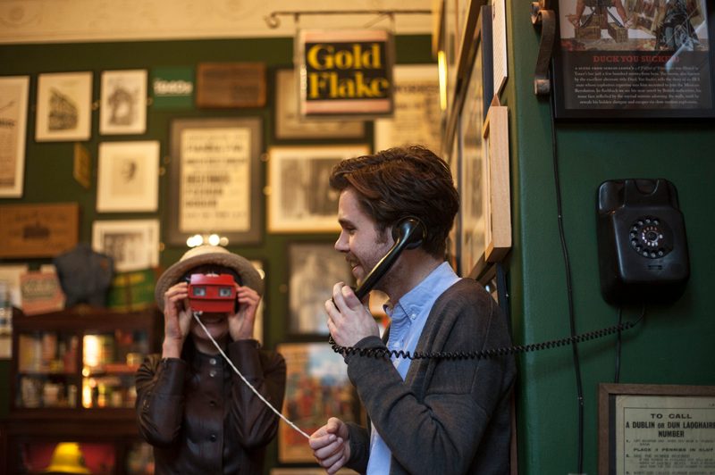 Man talking on a phone at The Little Museum of Dublin.