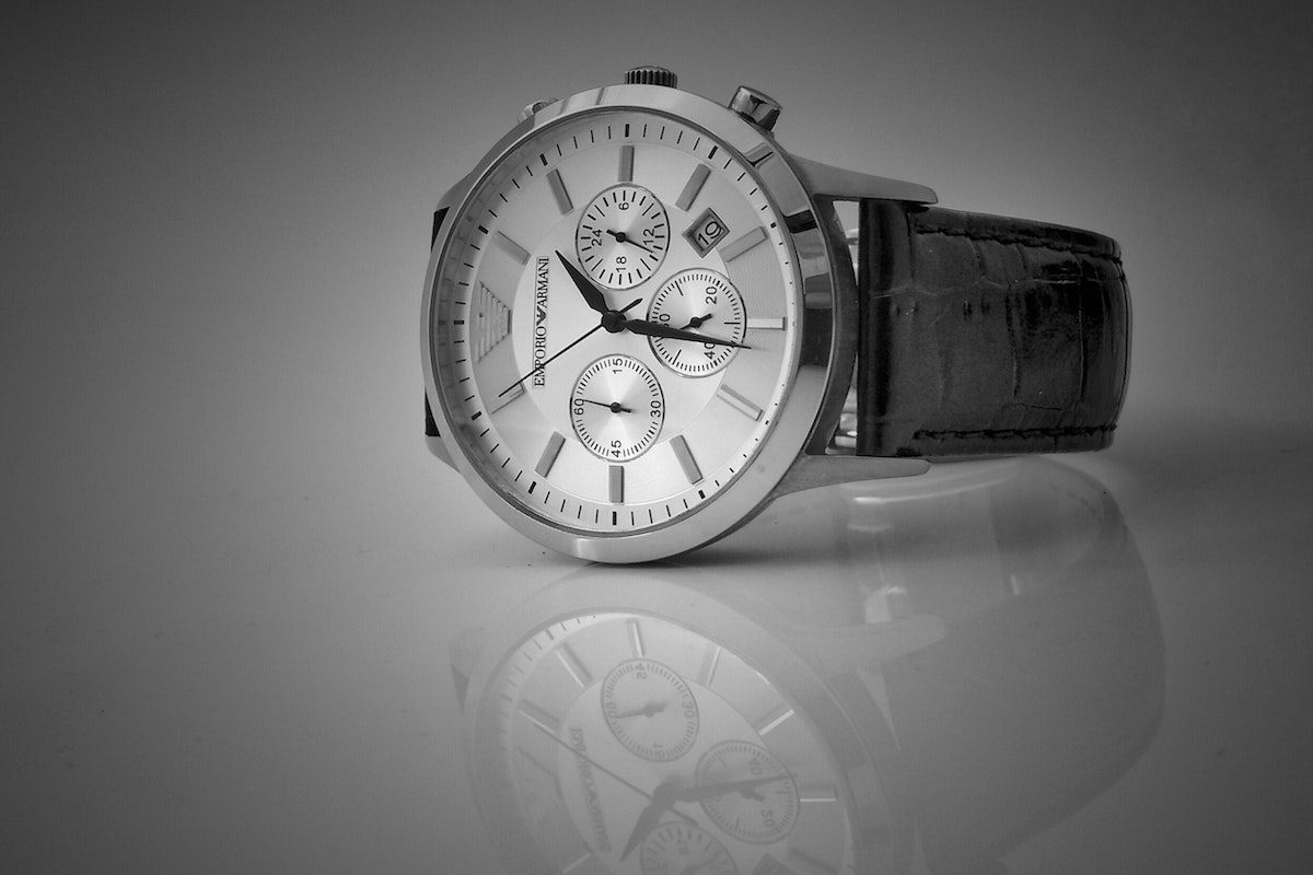 a luxury watch with a black wristband