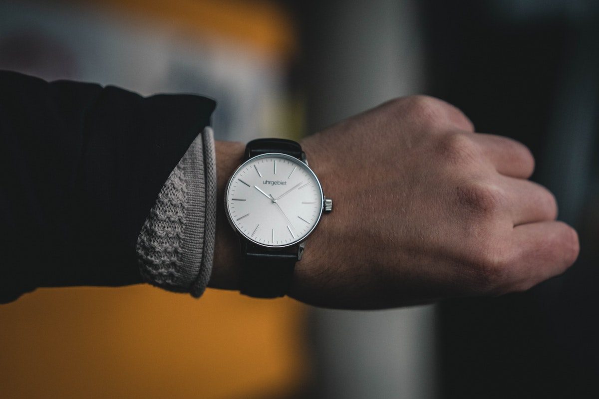 a man looking at watch