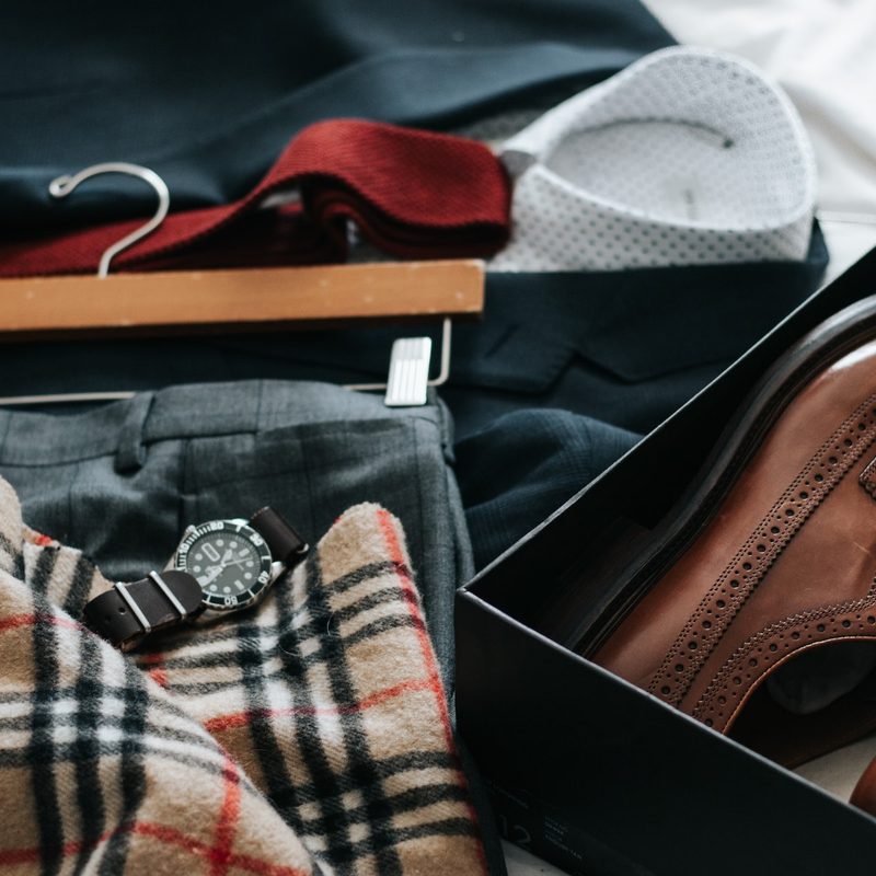 Various dress clothes out ready to be packed.