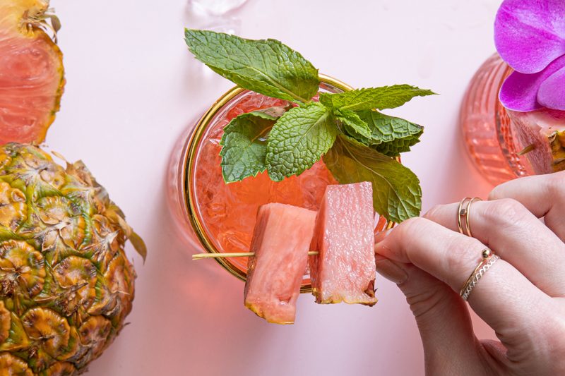 A drink garnished with Pinkglow pineapple.