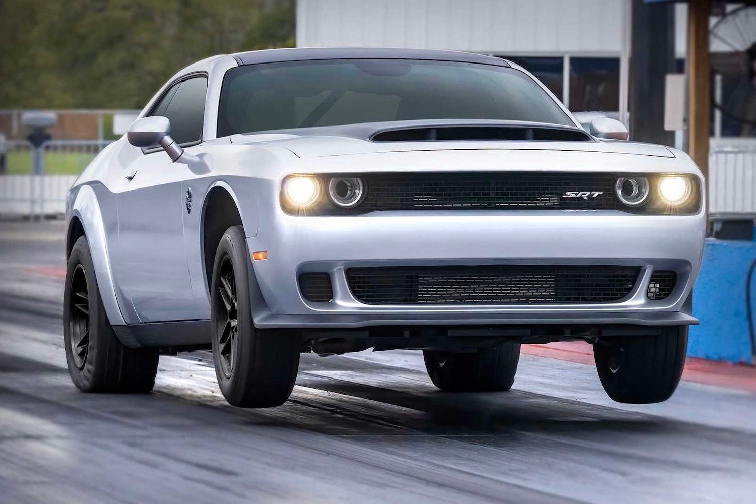 2023 Dodge Challenger SRT Demon 170 pulling a wheelie on a drag strip.