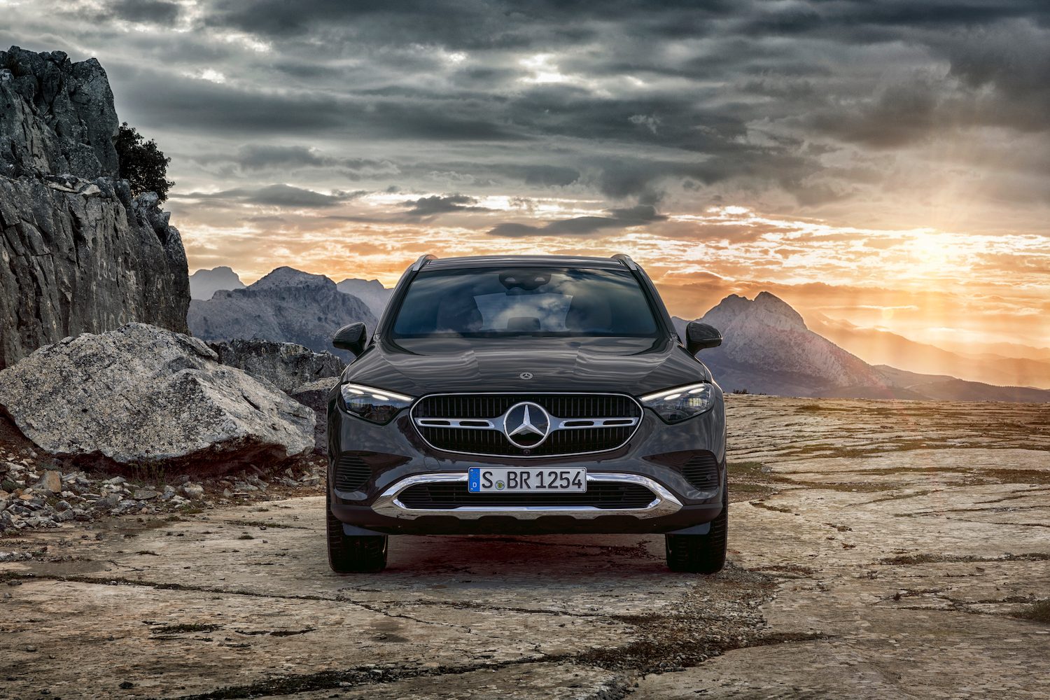 Front end close up of the 2023 Mercedes-Benz GLC parked in front of mountains.