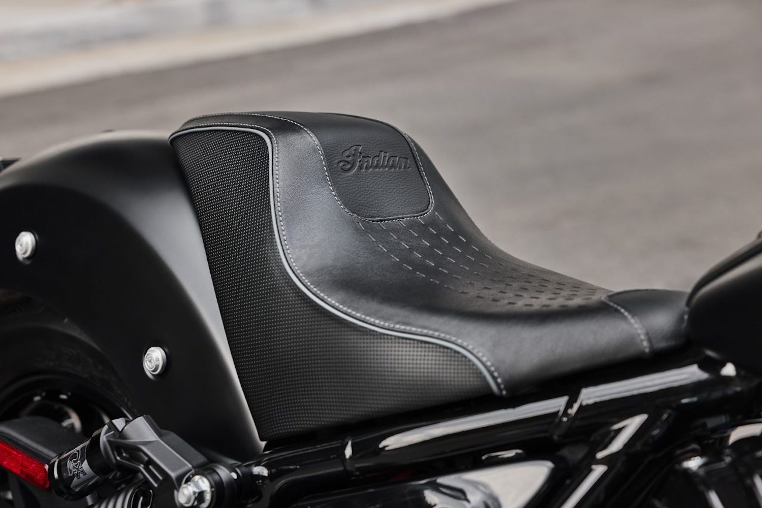 Close up of seat on the 2023 Indian Sport Chief parked under an underpass.