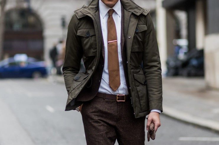 Man in suit and brown tie