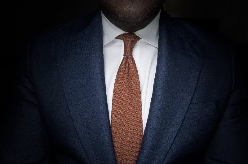 Man in suite and orange tie