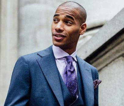 Man in suit and purple tie