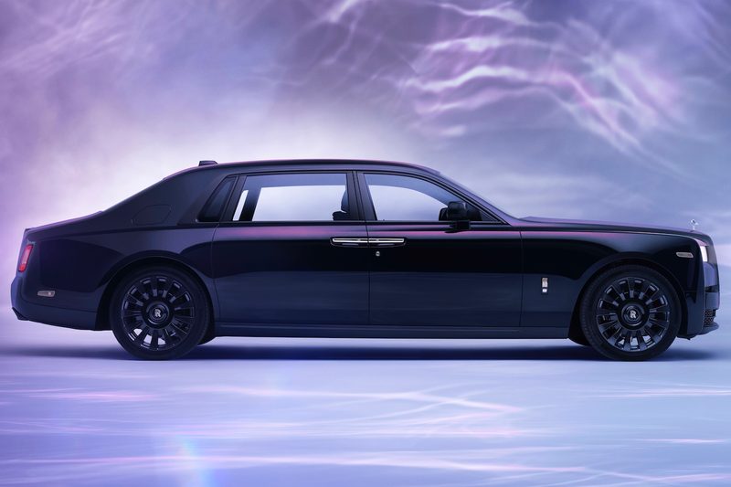 Rolls-Royce Phantom Syntopia side profile in a studio with purple swirling lines in the back.