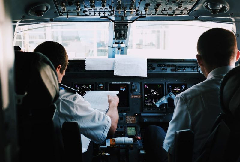 Two pilots flying a plane.