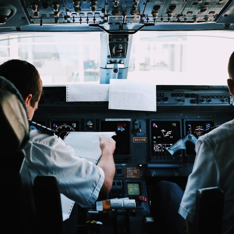 Two pilots flying a plane