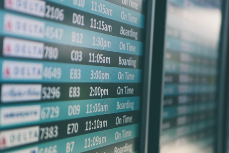 A flight departure board at an airport.